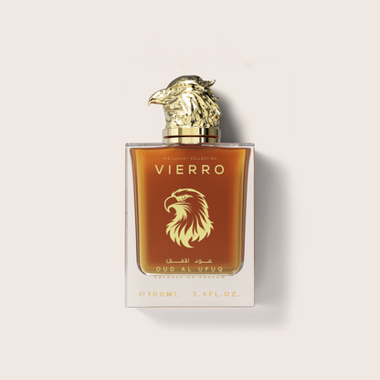 A 100ml glass bottle of Vierro Oud Al Ufuq perfume featuring a detailed gold falcon head cap and warm amber liquid inside, set against a neutral light background.